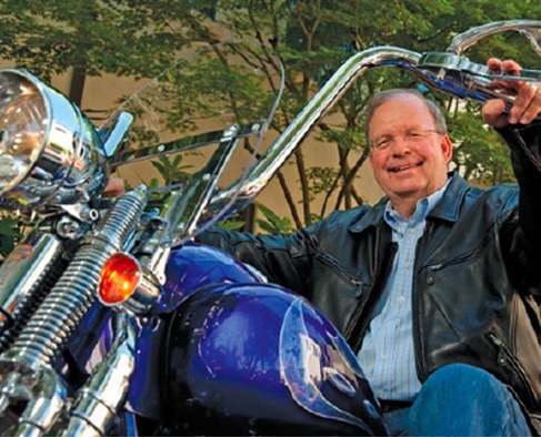 Chuck Toeniskoetter on Motorcycle