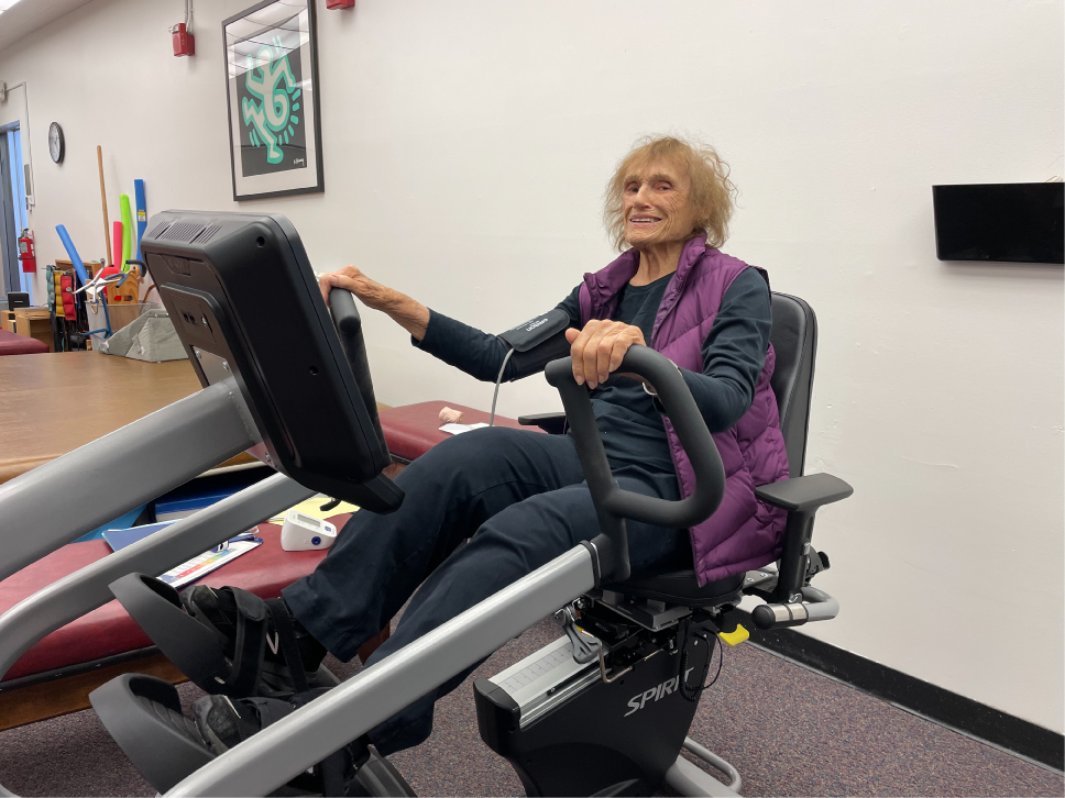 Woman on an elliptical bike